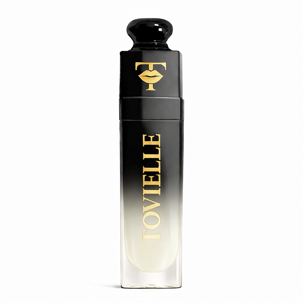 TOVIELLE Coconut Cream Lip Oil with soft milky nude shade in clear gloss tube with gold cap on neutral background