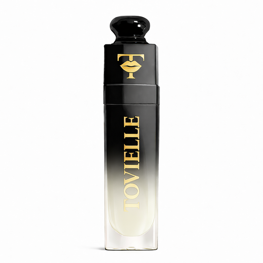 TOVIELLE Coconut Cream Lip Oil with soft milky nude shade in clear gloss tube with gold cap on neutral background