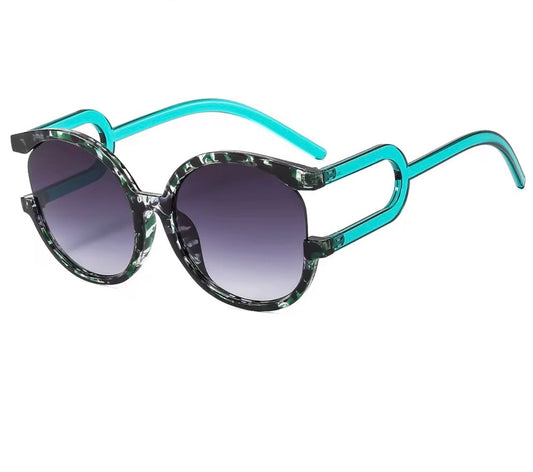 Sunglasses with turquoise/emerald/green frame and gradient lenses
