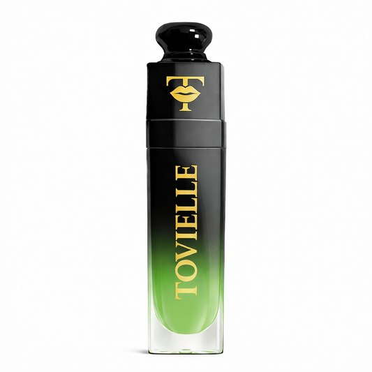 TOVIELLE Green Apple Glow Lip Oil in soft green tinted shade with glossy finish in clear tube with gold cap on neutral background