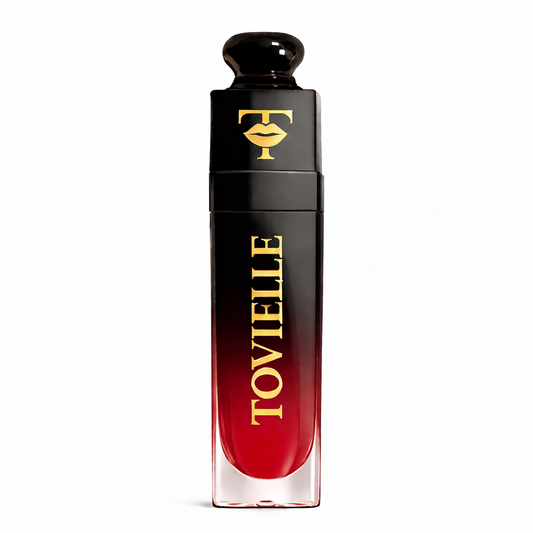 TOVIELLE Maple Love Lip Oil in warm red wine tinted shade with glossy finish in clear tube with gold cap on neutral background