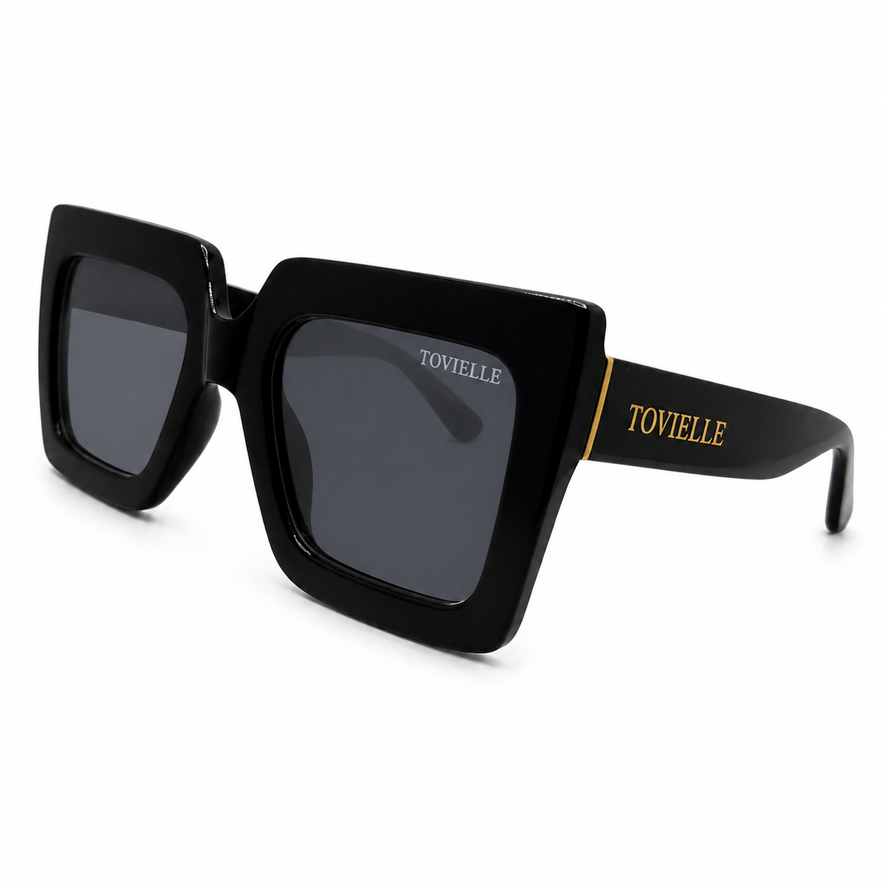 Oversized black Regent Noir sunglasses by Tovielle with sculpted square frame, dark lenses and gold hardware accents
