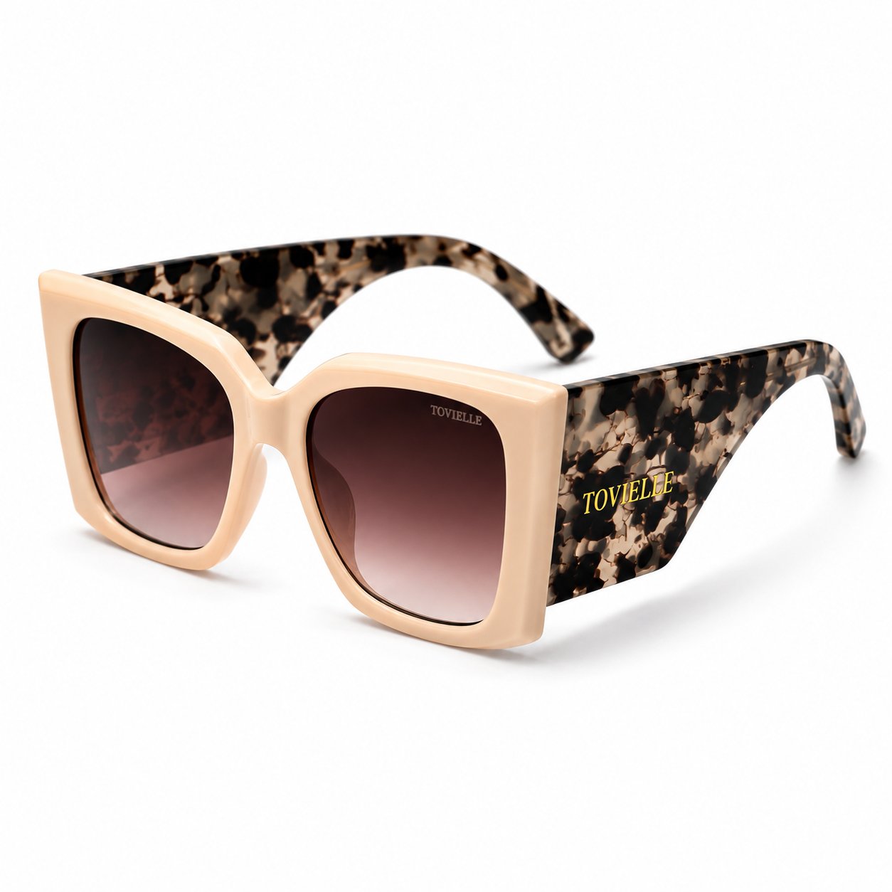 Tovielle Riviera Tortoise luxury sunglasses featuring an oversized ivory frame, tortoise pattern temples, gradient tinted lenses, and signature gold logo detailing on a clean studio background.