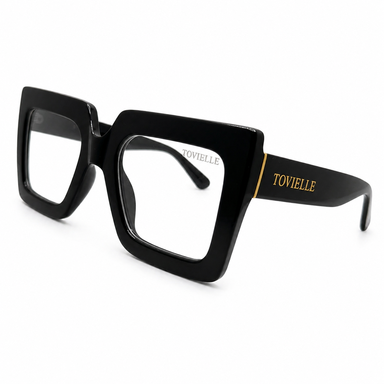 Oversized black Regent Noir optical frames by Tovielle with sculpted square silhouette and gold temple detail