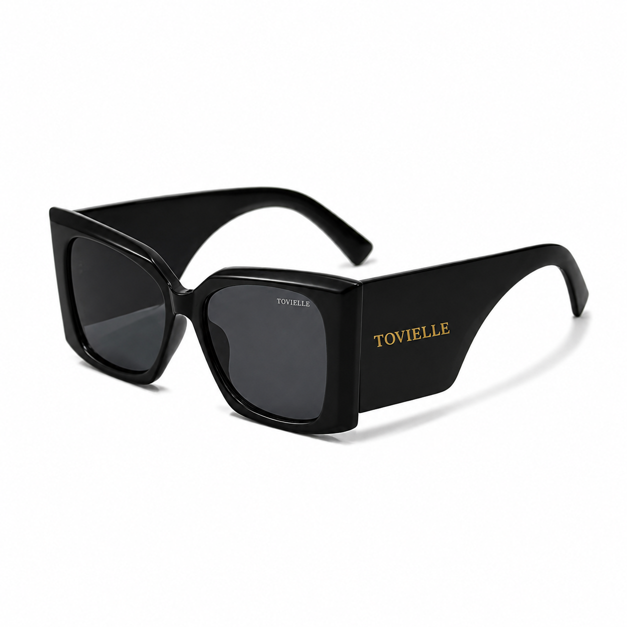 Tovielle Riviera Noir luxury sunglasses featuring an oversized black frame, dark tinted lenses, and signature gold logo detailing on a clean studio background.