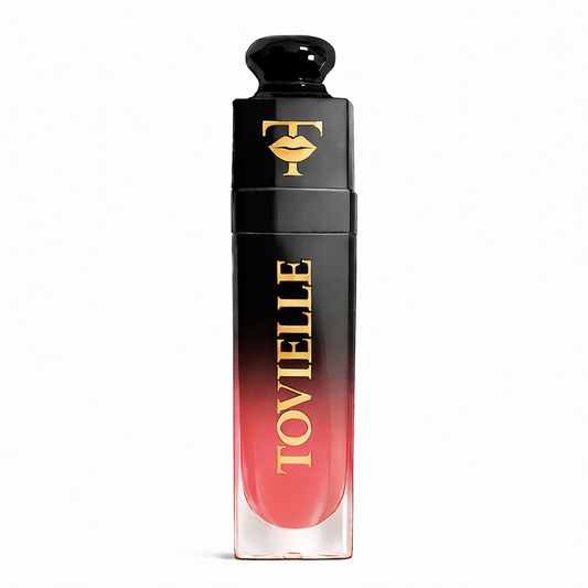 TOVIELLE Watermelon Glow Lip Oil in soft pink watermelon shade with glossy finish in clear tube with gold cap on neutral background